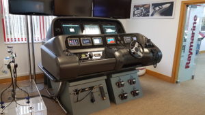 Simulation of a Sunseeker console with integrated chart plotters and empire bus digital switching at the training suite at the Raymarine Head office in Fareham.