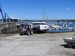 2B3 42 Lagoon Catamaran being launched on the slipway at Mylor Yacht Harbour, Cornwall