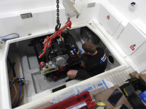 Lead marine engineer installing a new Volvo Penta V8-300-C/DPS into a sealine 255 classic spead boat at Mylor Yacht Harbour