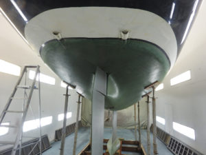 The underside of Mystery 35 yacht Francesca of Fowey in the workshop at Mylor Yacht Harbour