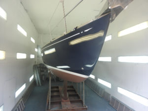 Francesca of Fowey in the Mylor Workshop after her paint job and Coppercoat is completed