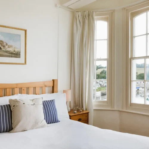 View over Mylor Yacht Harbour from the window of a double bedroom within Kingsmoor Seafront Cottage - Harbour Holidays